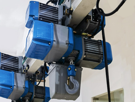 Multiple European-style chain hoists are undergoing strict factory tests